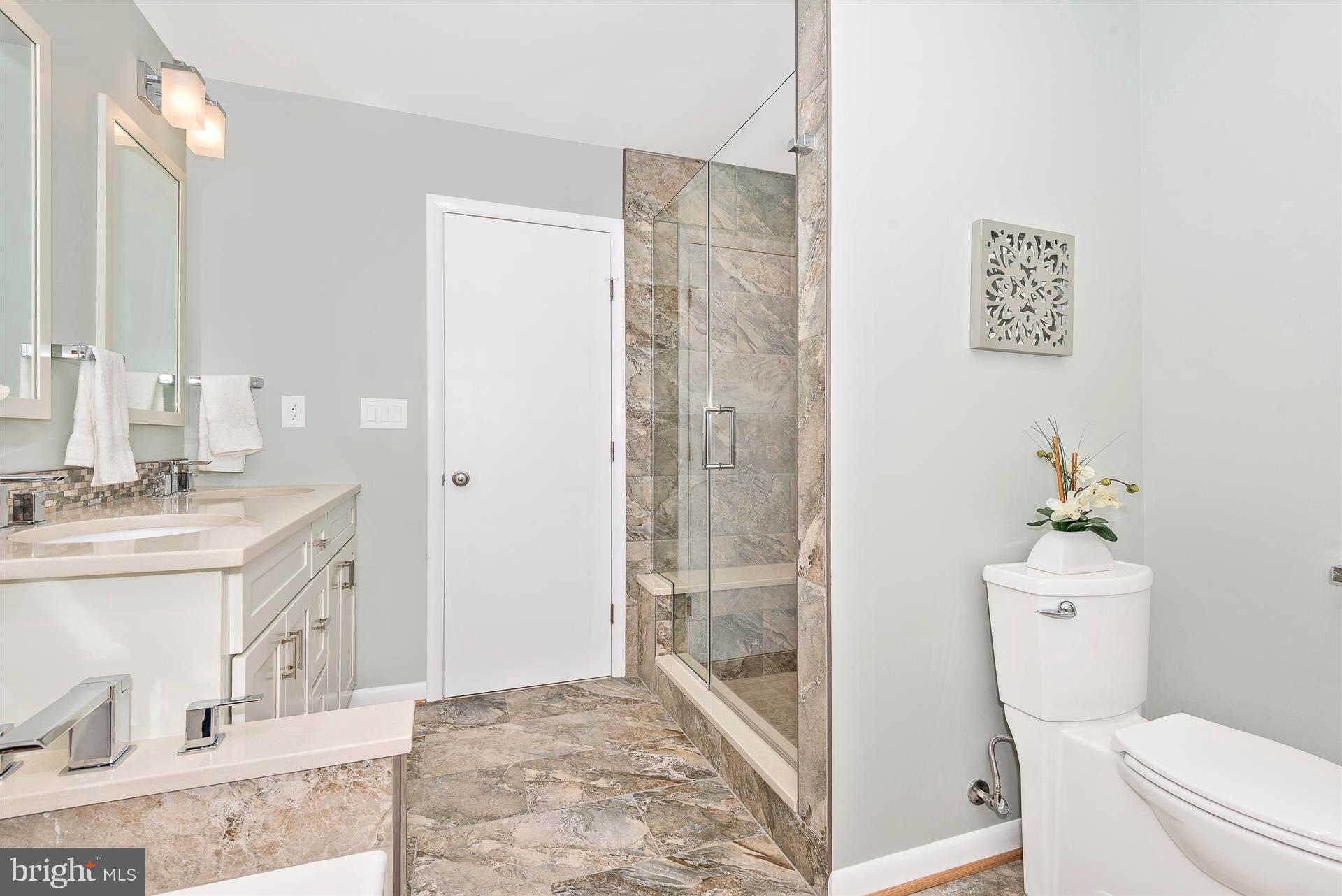 9416 Emory Grove Road Gaithersburg, MD 20877 - Photo 23 of 30 a bathroom with a sink a toilet and shower