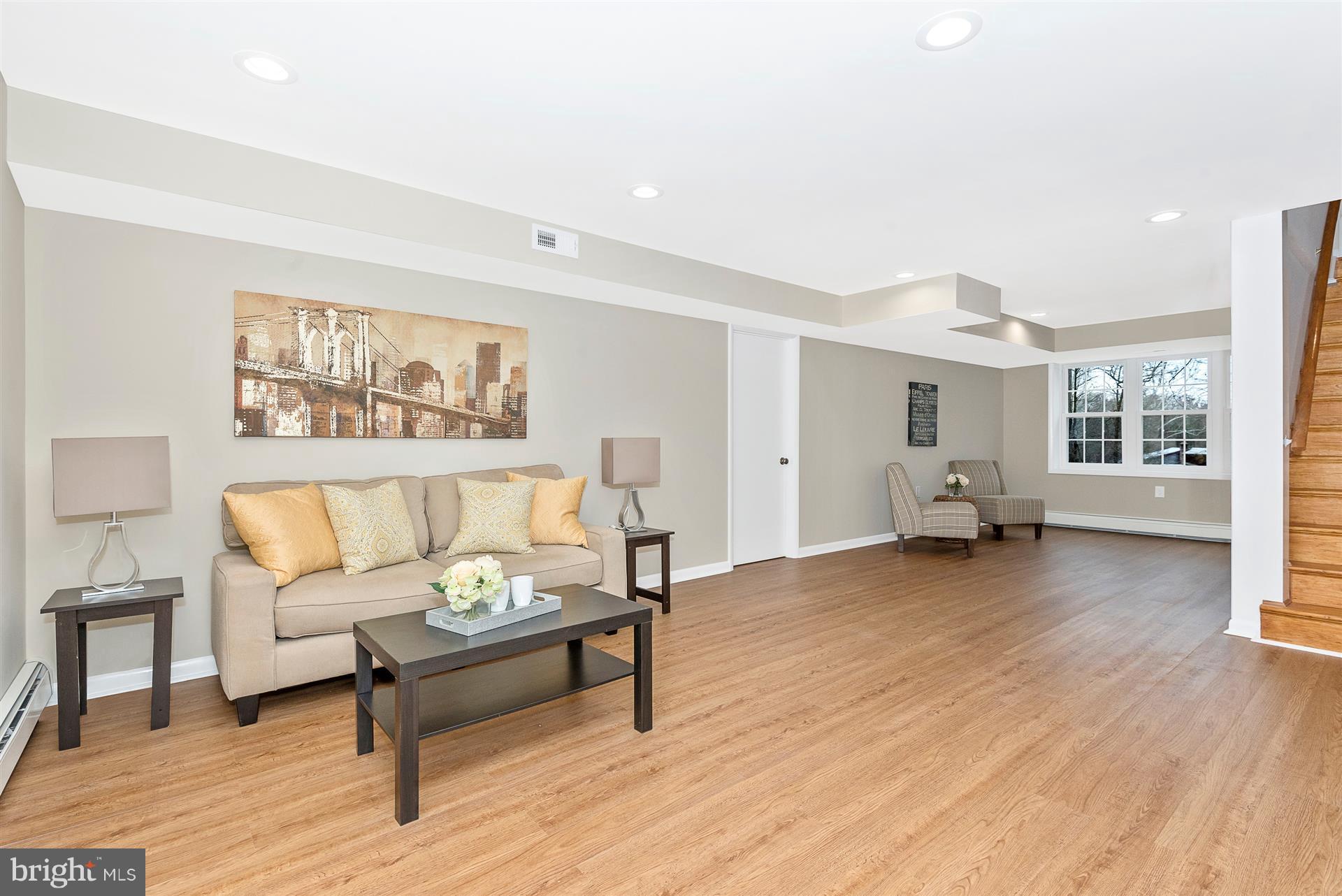 9416 Emory Grove Road Gaithersburg, MD 20877 - Photo 30 of 30 a living room with furniture and a wooden floor