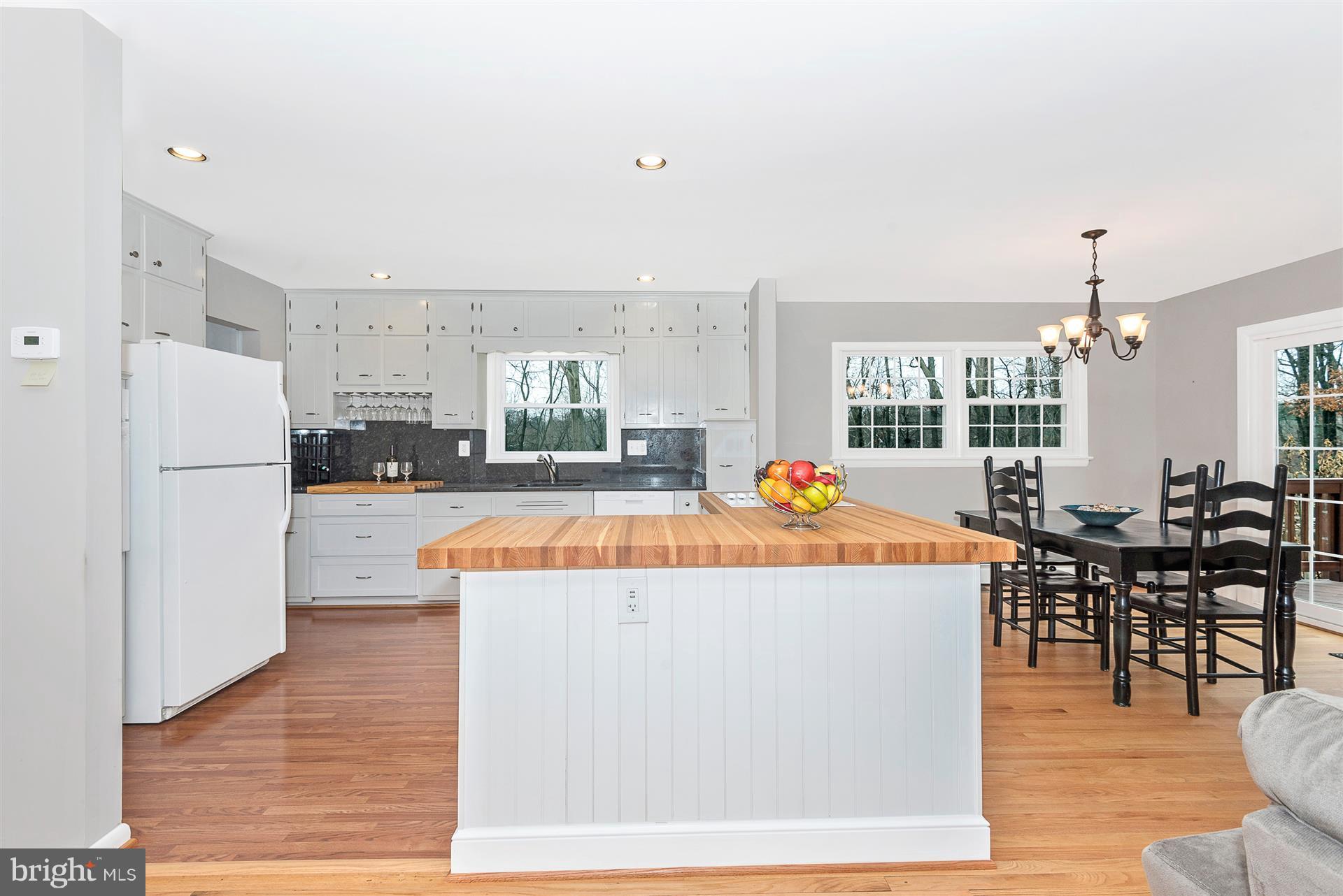 9416 Emory Grove Road Gaithersburg, MD 20877 - Photo 8 of 30 a view of kitchen with furniture and wooden floor