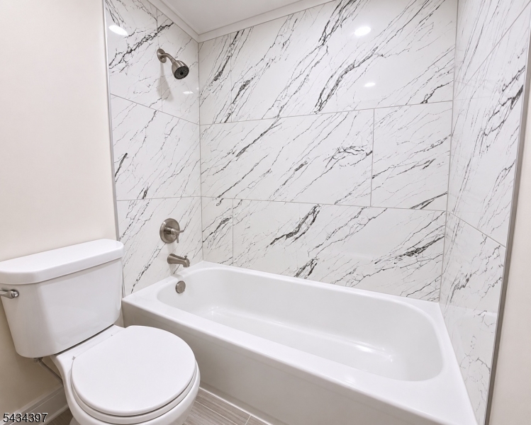 207 Old Chimney Ridge Road, Unit L Montague, NJ 07827 - Photo 13 of 14 a bathroom with a toilet and a bathtub