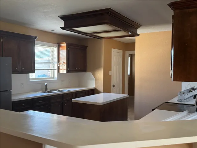 a large bathroom with a large tub and sink