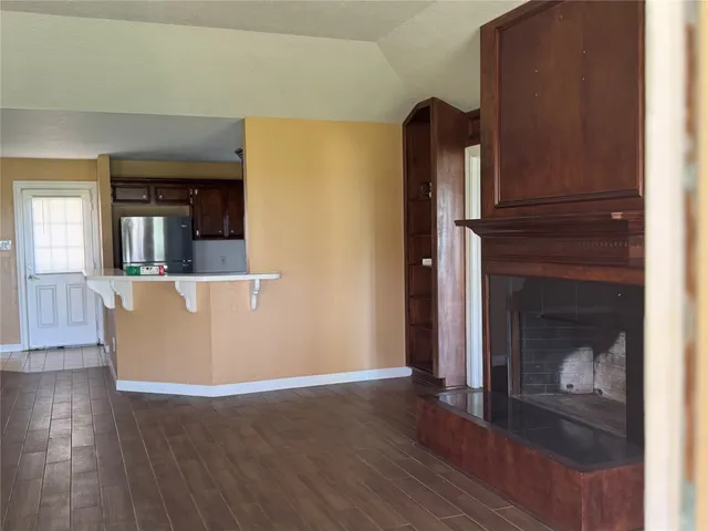 a view of a living room that has a fireplace