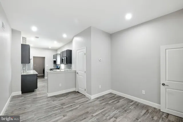 a view of kitchen with stainless steel appliances refrigerator oven and microwave