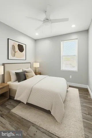 a bedroom with bed and window