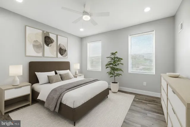 a spacious bedroom with a large bed and a window