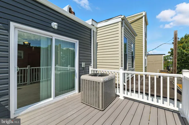 a view of a balcony with wooden floor