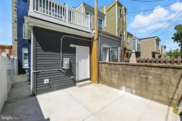 a view of a brick building with many windows