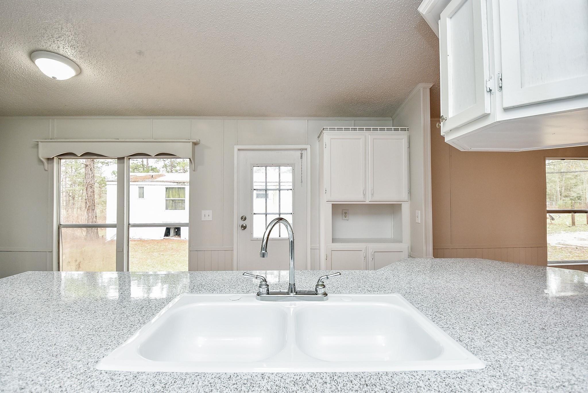 12842 Roy Harris Loop Conroe, TX 77306 - Photo 23 of 36 a bathroom with double vanity and a mirror