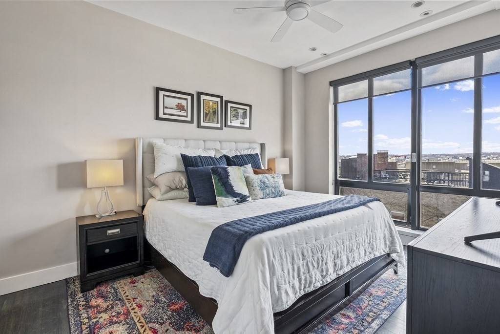 36 A, Unit 5E Boston, MA 02127 - Photo 15 of 38 a bedroom with a bed and a large window