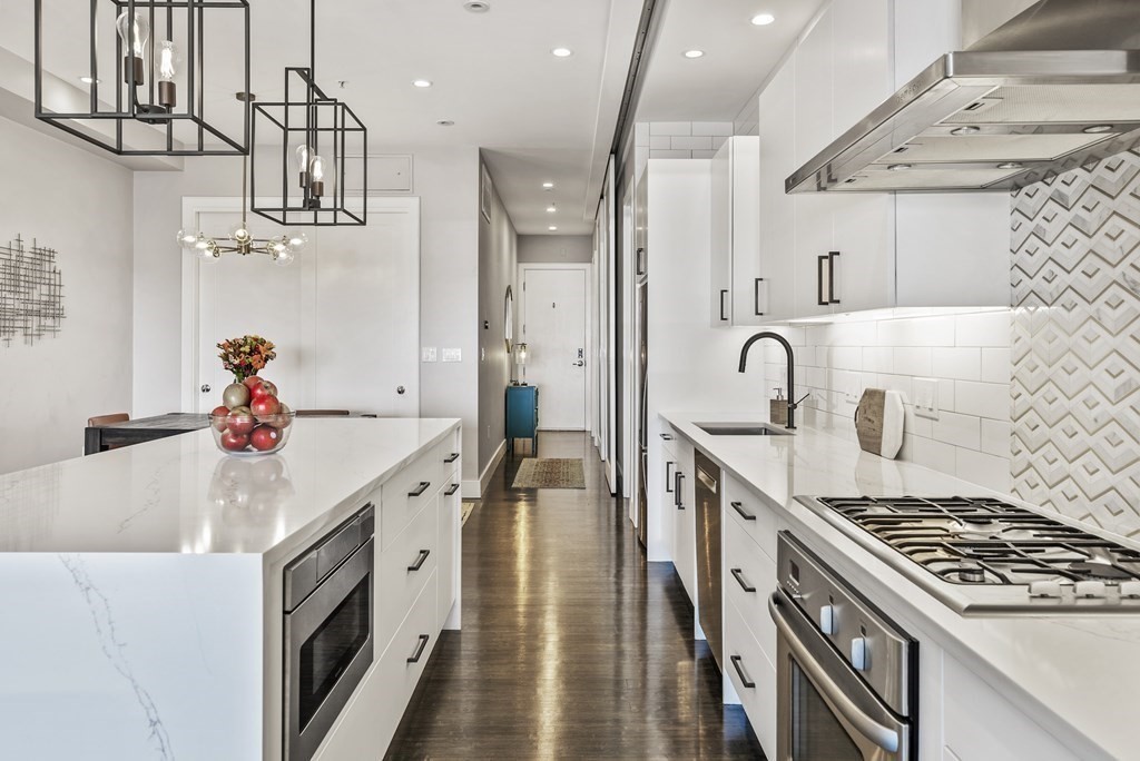 36 A, Unit 5E Boston, MA 02127 - Photo 3 of 38 a kitchen with a sink appliances and cabinets