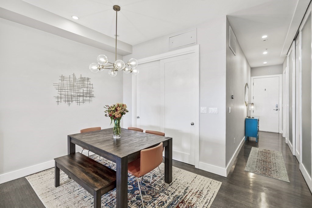 36 A, Unit 5E Boston, MA 02127 - Photo 10 of 38 a dining room with a table and chairs