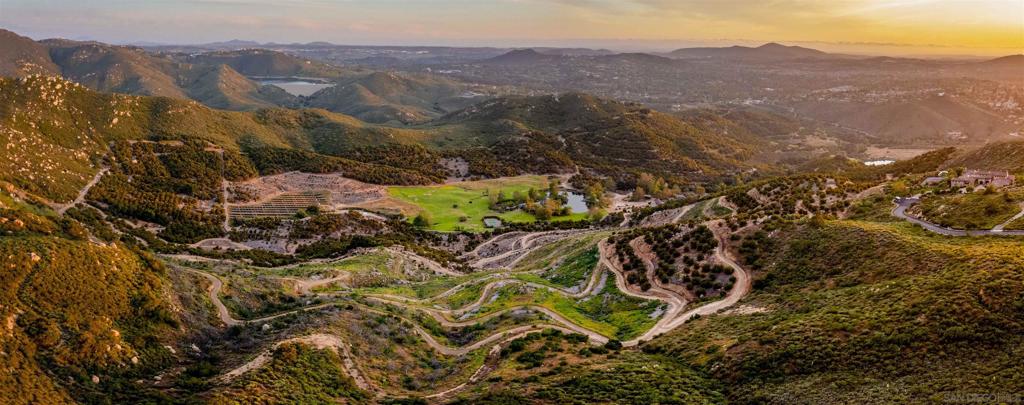 18035 Sunset Point Poway, CA 92064 - Photo 14 of 62 a view of a lush green hillside and houses