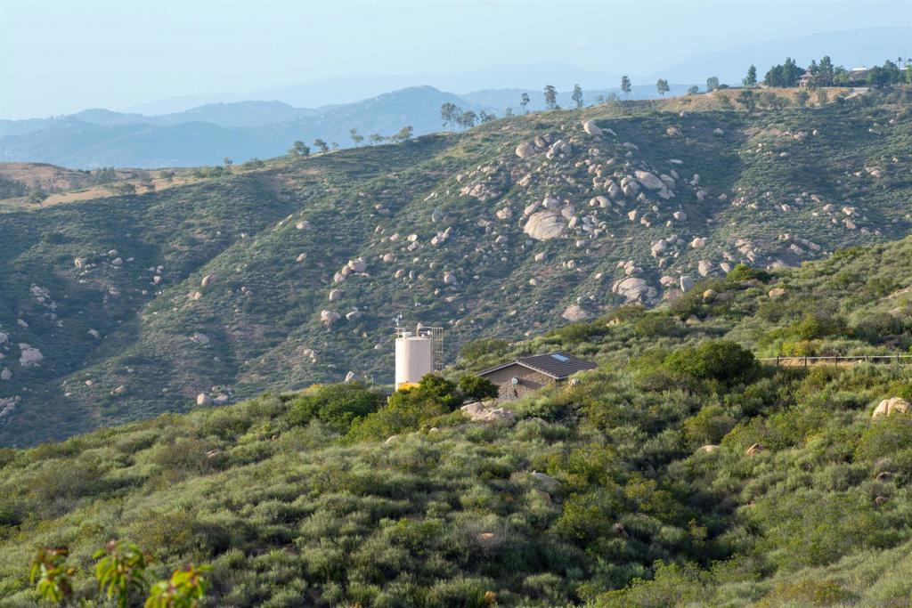 18035 Sunset Point Poway, CA 92064 - Photo 27 of 62 an aerial view of house with yard and mountain view in back