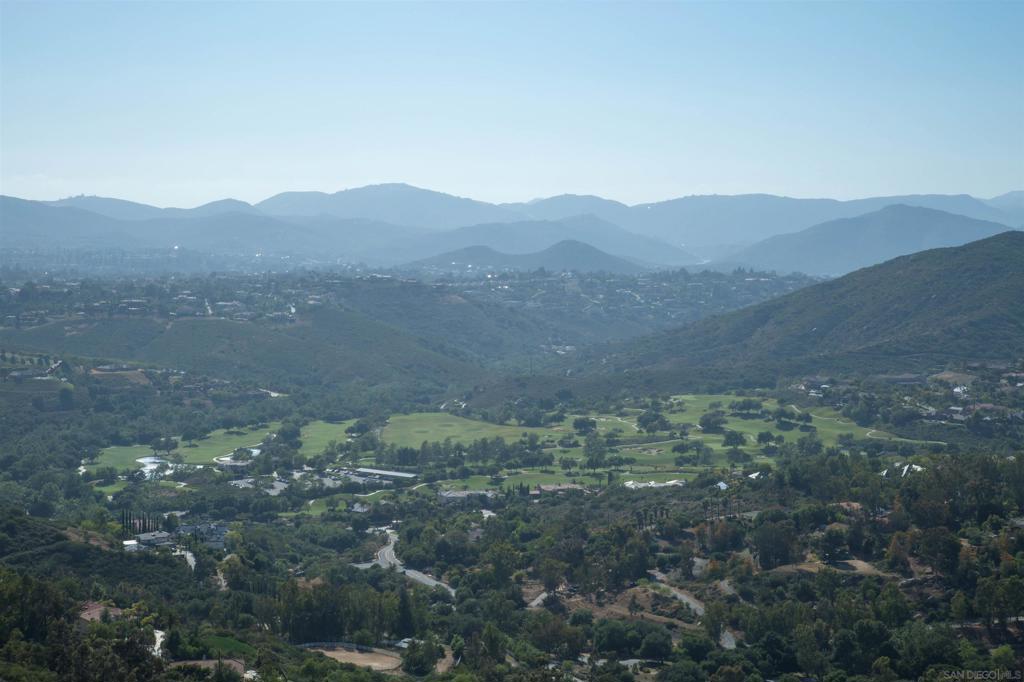 18035 Sunset Point Poway, CA 92064 - Photo 49 of 62 a view of a mountain in the distance in a field