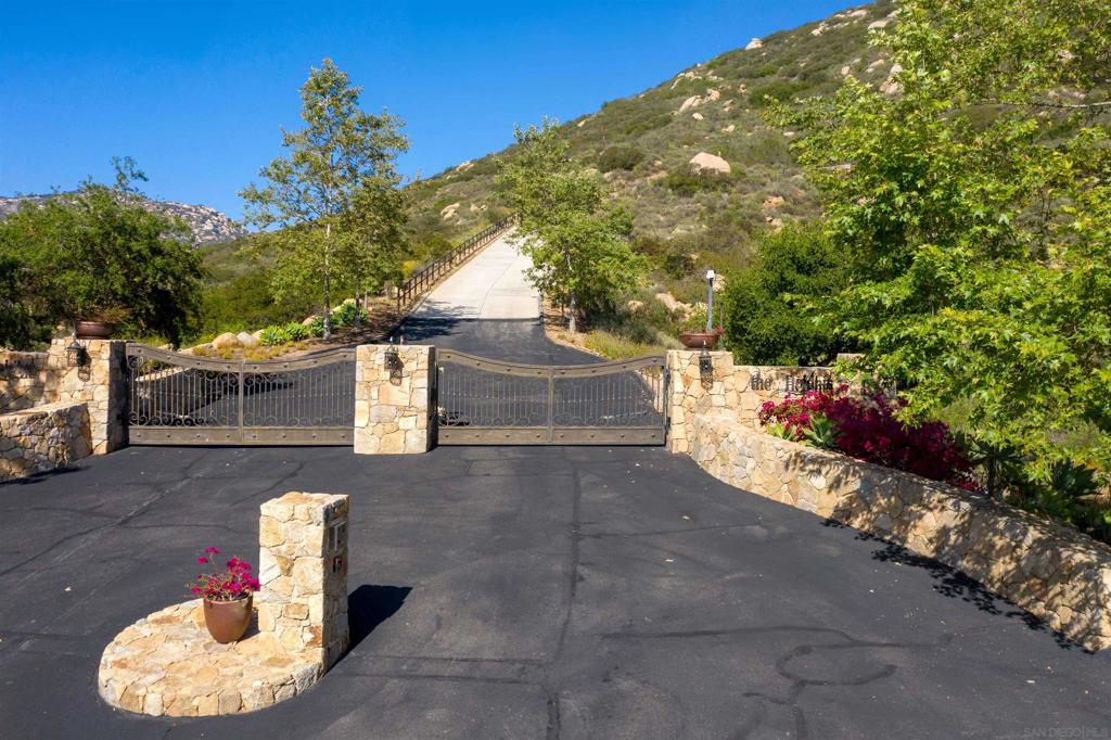 18035 Sunset Point Poway, CA 92064 - Photo 53 of 62 a front view of a house with a yard