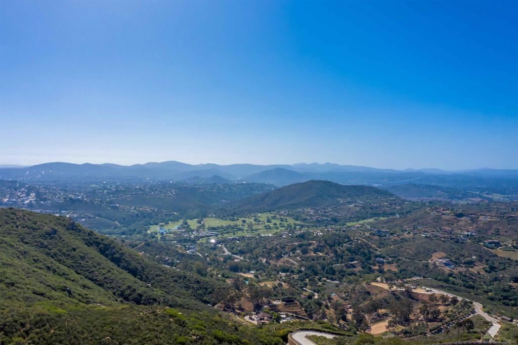 18035 Sunset Point Poway, CA 92064 - Photo 55 of 62 a view of a large mountain with mountains in the background