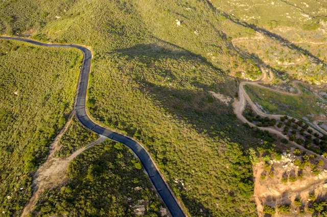 a view of a mountain range in a cloudy sky