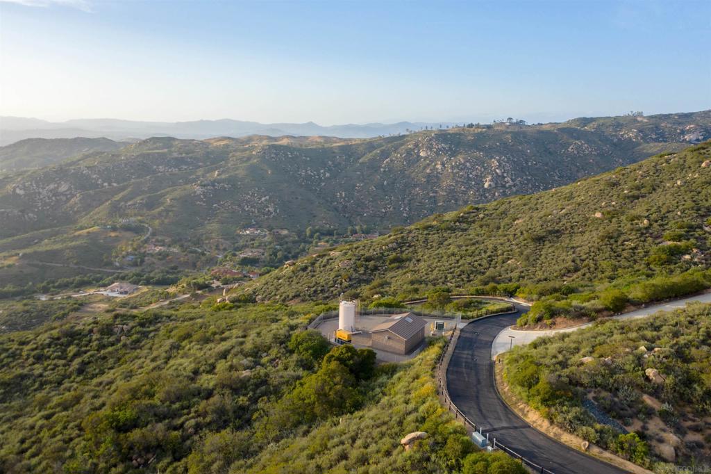 18035 Sunset Point Poway, CA 92064 - Photo 9 of 62 an aerial view of mountain with residential house and mountain view