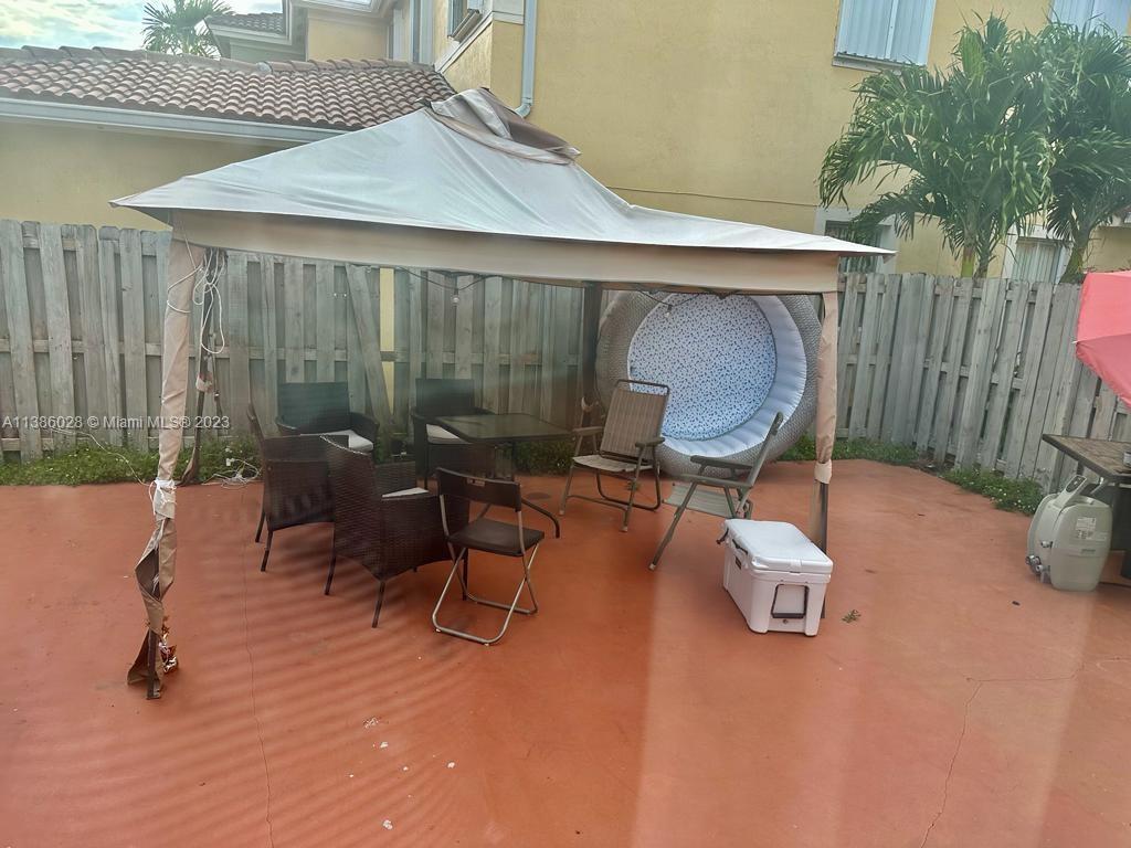 4830 Southwest 163rd Place Miami, FL 33185 - Photo 20 of 23 a view of a two chairs in a patio