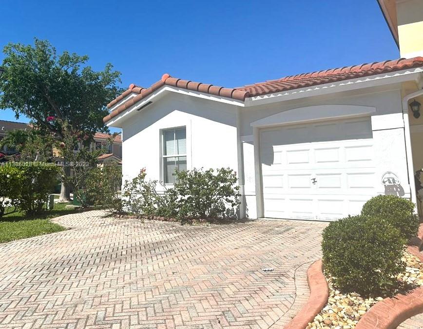 4830 Southwest 163rd Place Miami, FL 33185 - Photo 2 of 23 a view of a house with a yard
