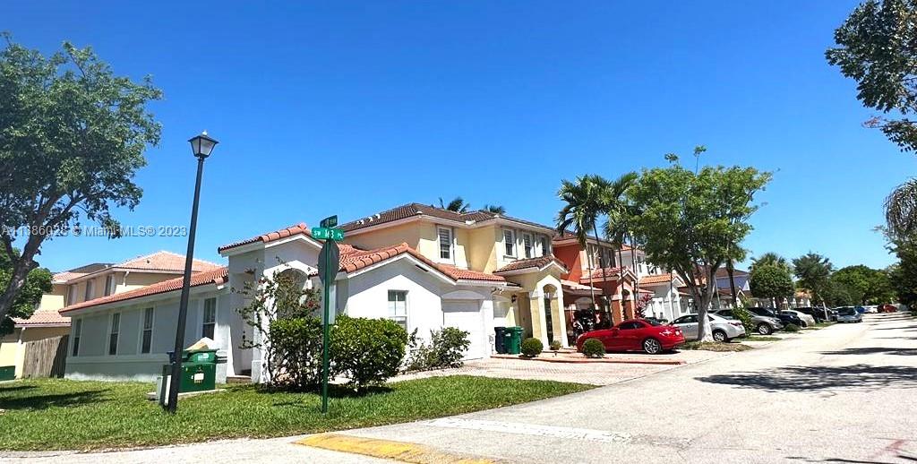 4830 Southwest 163rd Place Miami, FL 33185 - Photo 7 of 23 a front view of a house with a yard