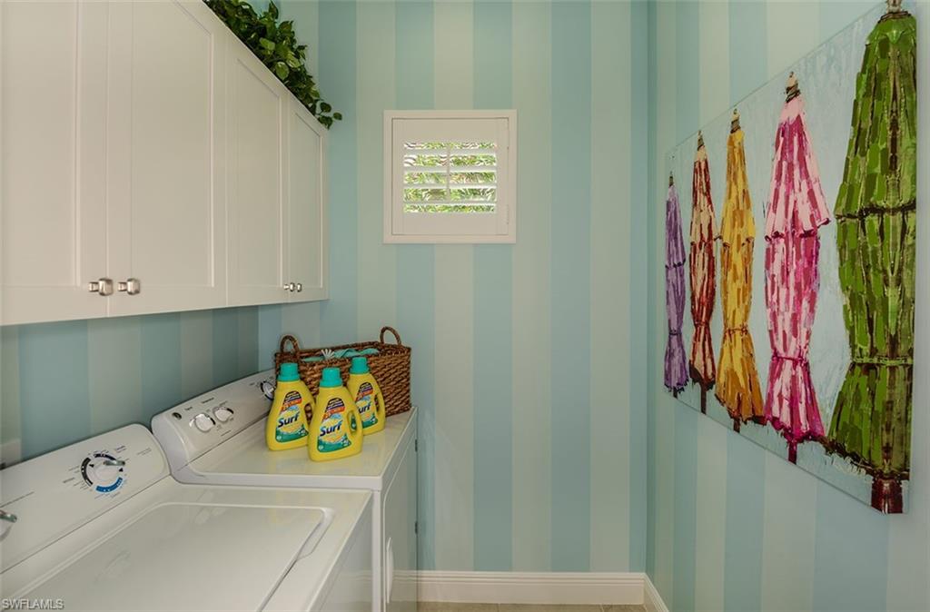 4665 Centaurus Circle Naples, FL 34120 - Photo 12 of 16 a bathroom with a sink and a shower curtain