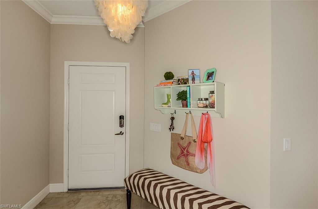 4665 Centaurus Circle Naples, FL 34120 - Photo 13 of 16 a bathroom with a sink and a mirror