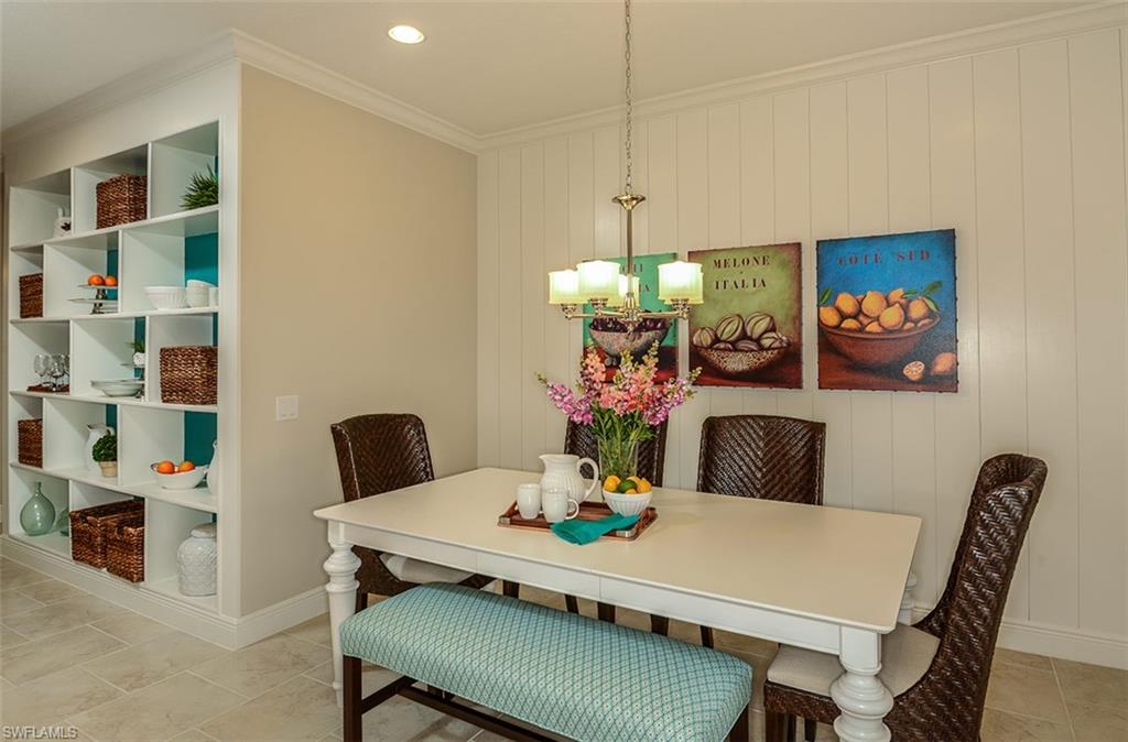 4665 Centaurus Circle Naples, FL 34120 - Photo 6 of 16 a view of a dining room with furniture