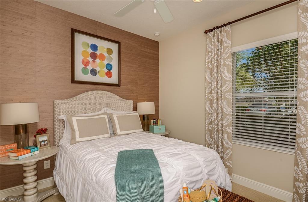 4665 Centaurus Circle Naples, FL 34120 - Photo 9 of 16 a bedroom with a bed and a painting on the wall
