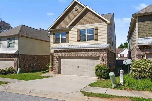 front view of a house and a yard