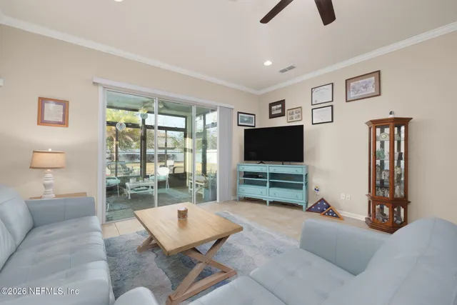 a bedroom with a bed couch and a window