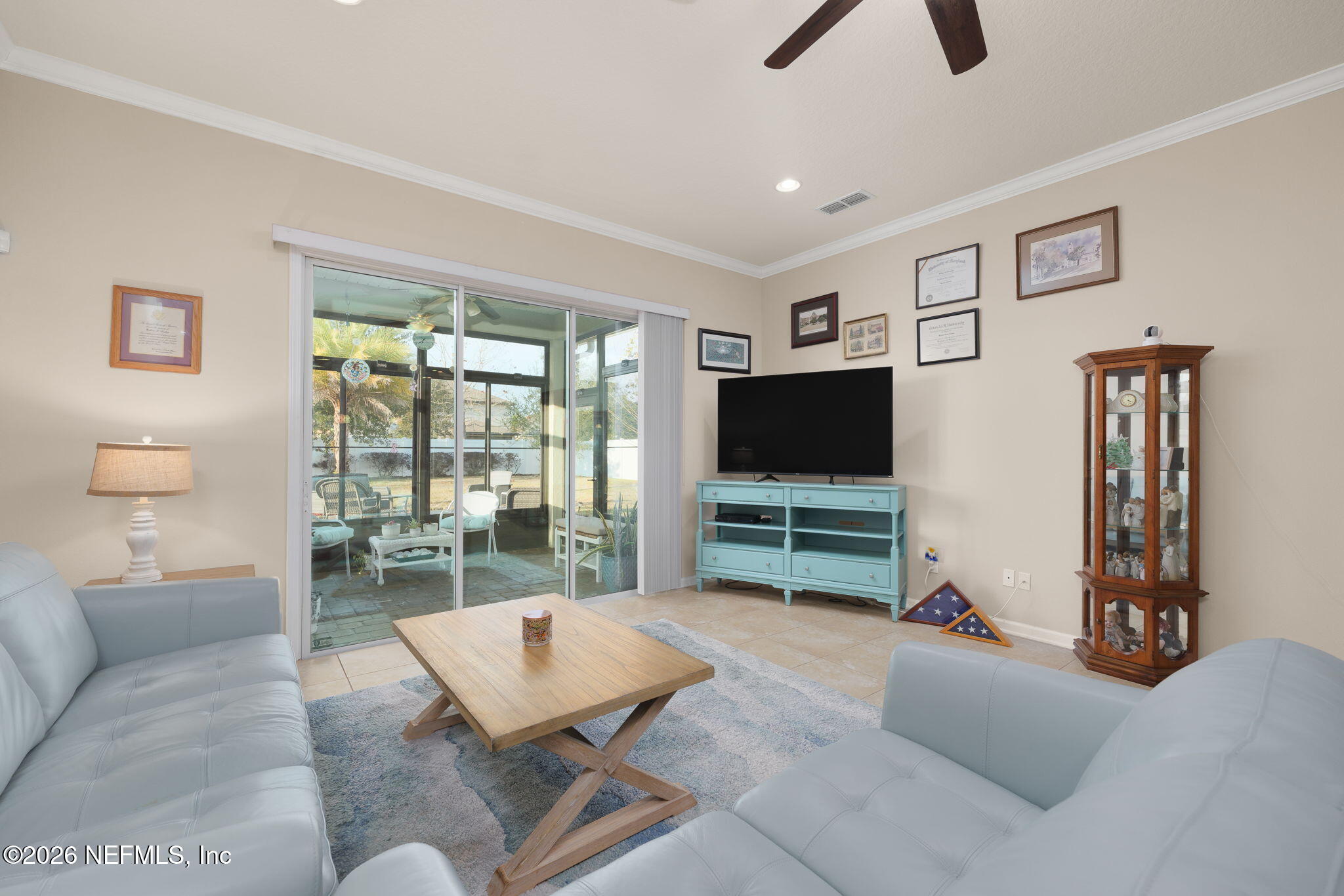 405 Porta Rosa Circle St. Augustine, FL 32092 - Photo 18 of 55 a living room with furniture and a flat screen tv