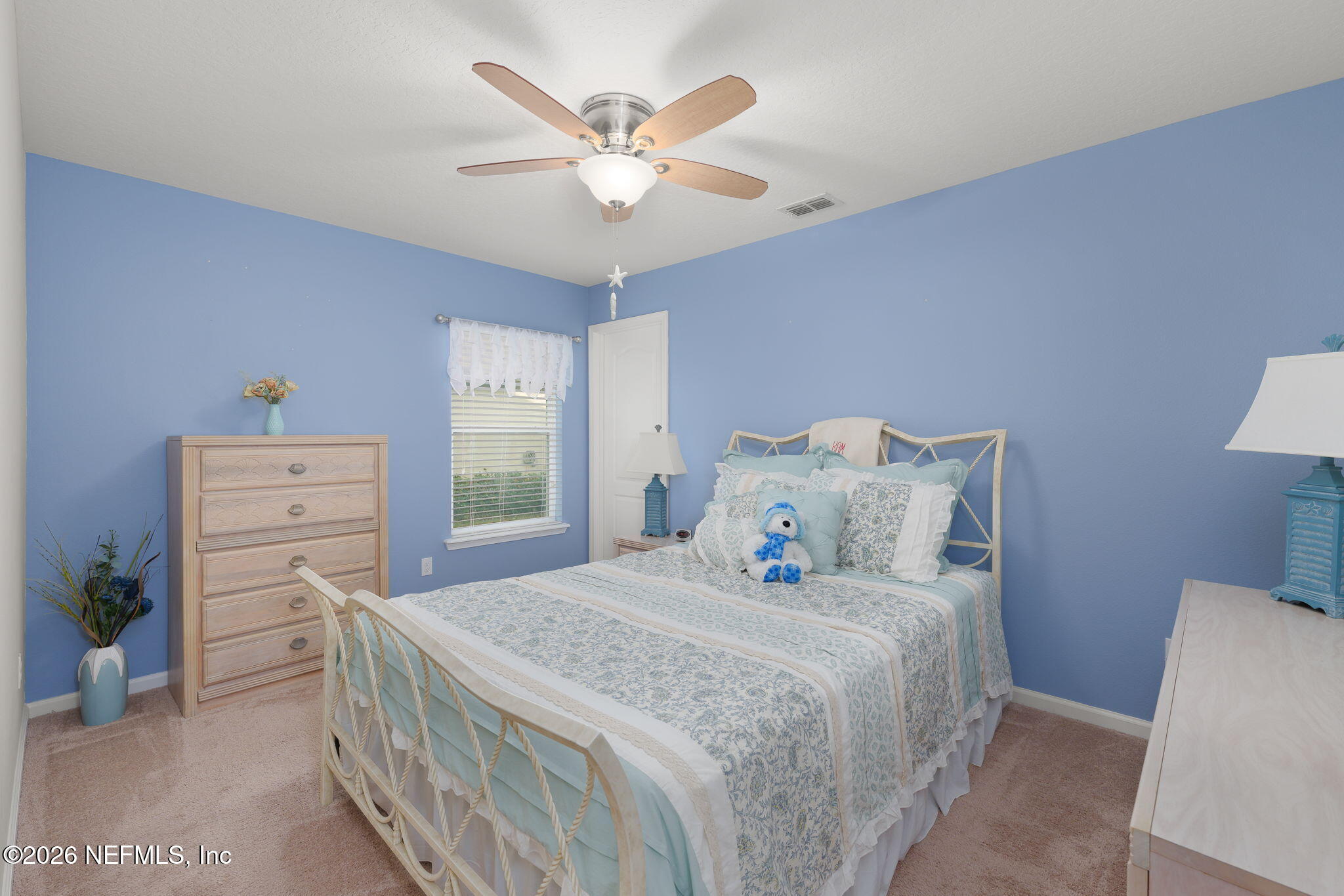 405 Porta Rosa Circle St. Augustine, FL 32092 - Photo 25 of 55 a bedroom with a bed and a window