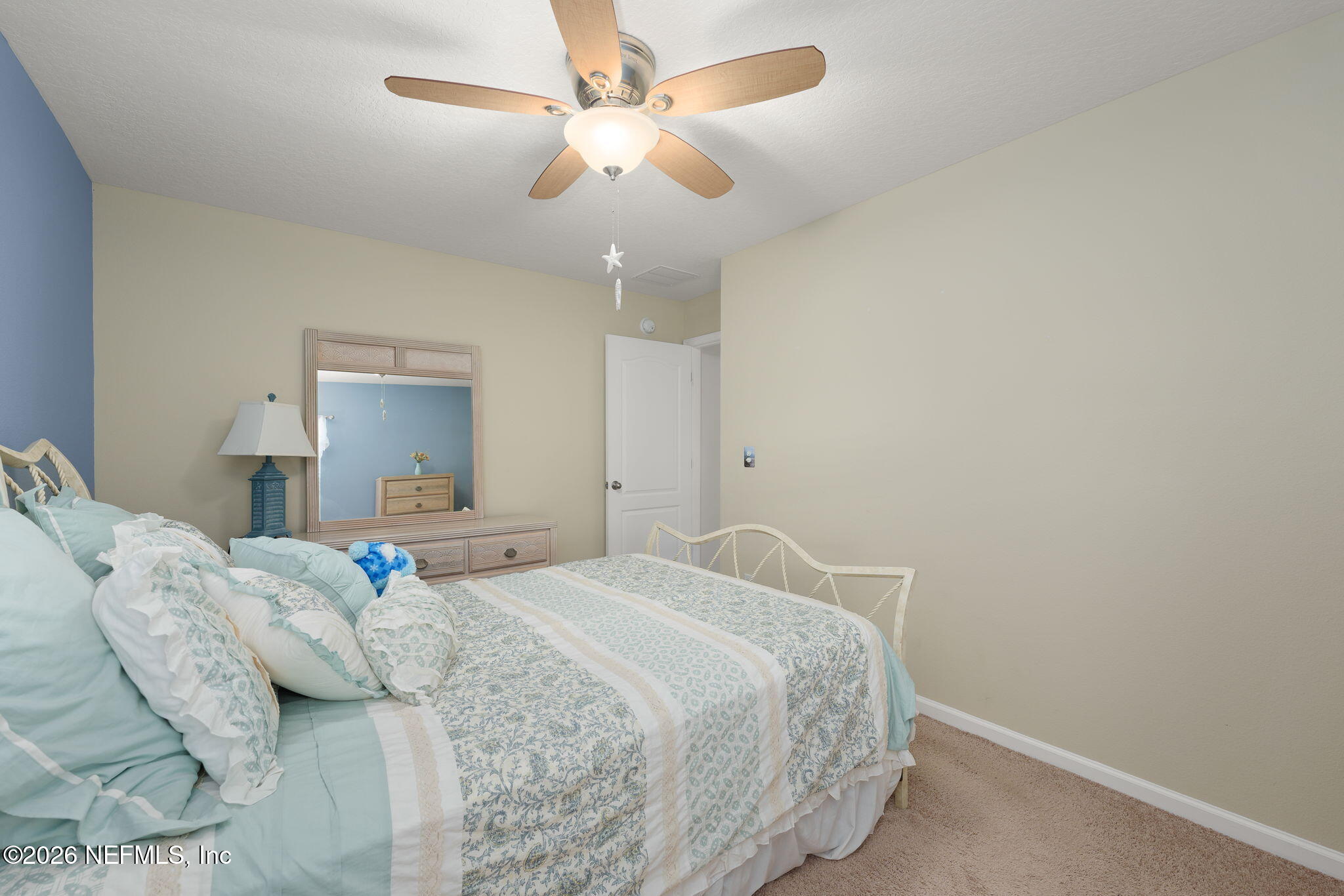 405 Porta Rosa Circle St. Augustine, FL 32092 - Photo 26 of 55 a bedroom with a bed and a ceiling fan