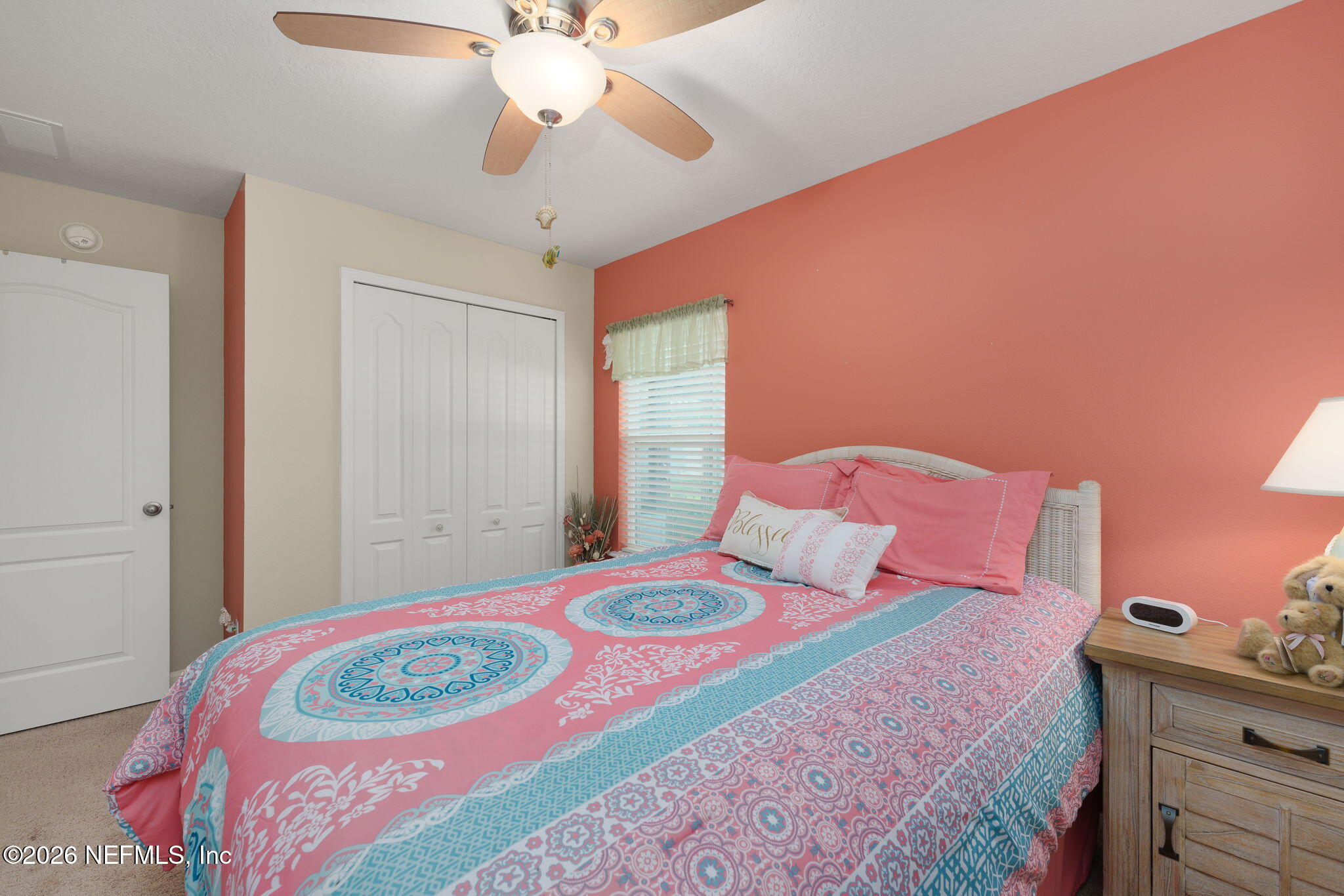 405 Porta Rosa Circle St. Augustine, FL 32092 - Photo 31 of 55 a bedroom with a bed and a chandelier