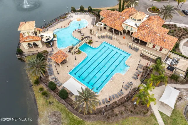 a view of a swimming pool with lounge chair