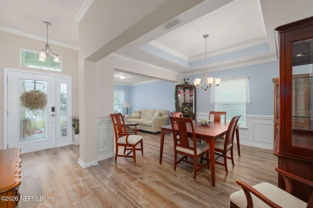 a living room with furniture a rug and a large window