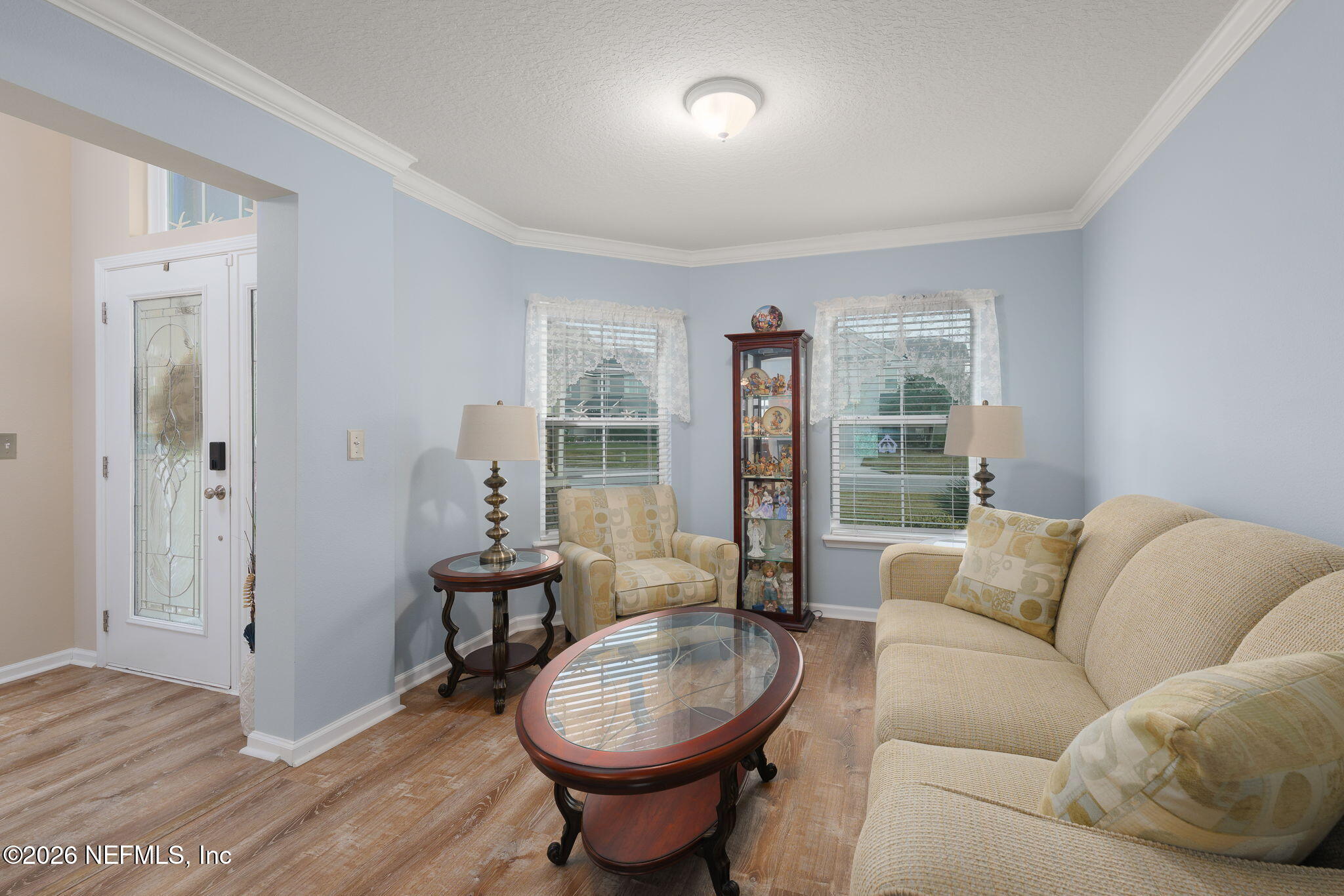 405 Porta Rosa Circle St. Augustine, FL 32092 - Photo 10 of 55 a living room with furniture a large window and wooden floor