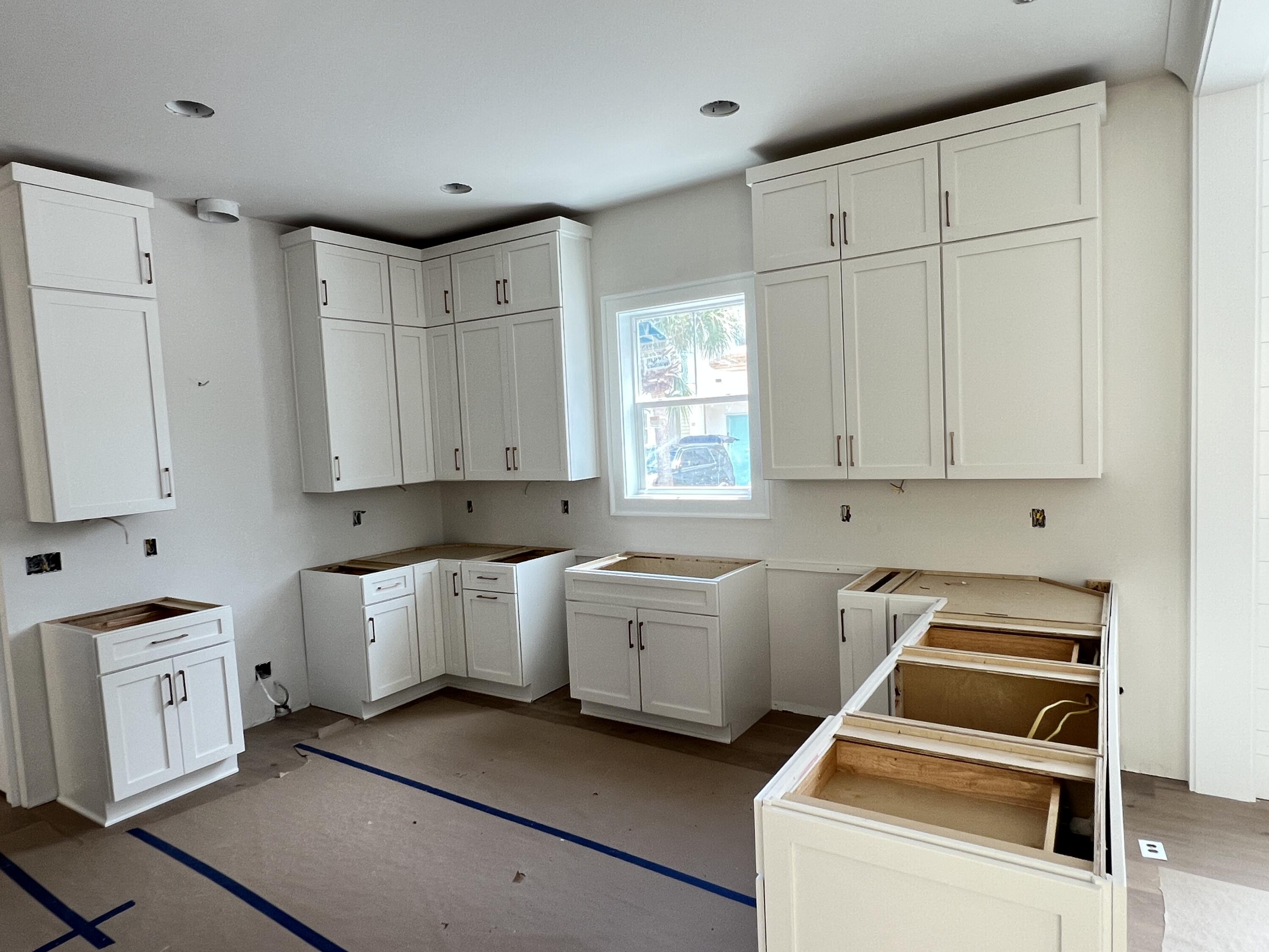40 Sand Flea Dr Inlet Beach Inlet Beach, FL 32461 - Photo 8 of 37 a kitchen with white cabinets and white appliances