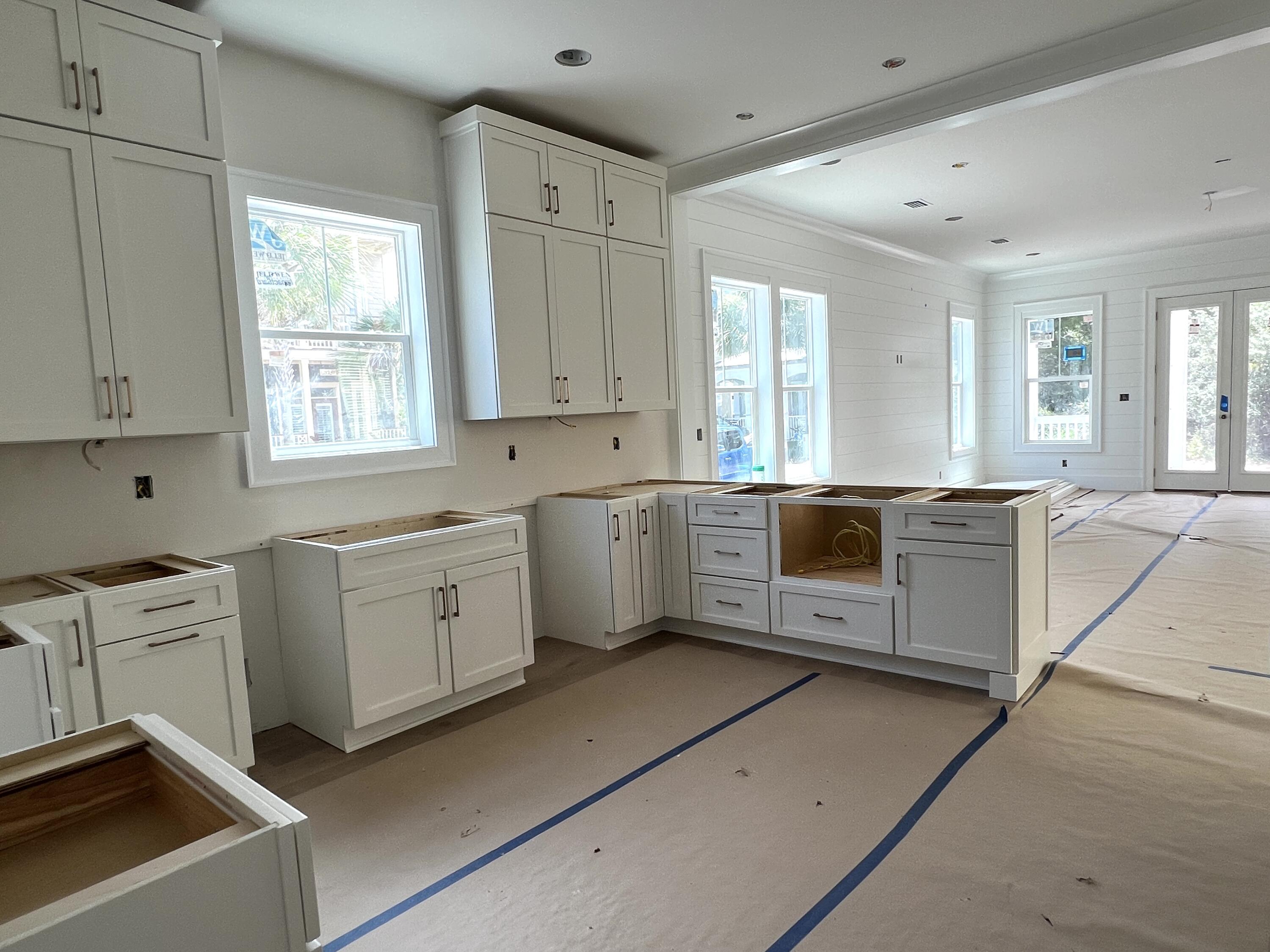 40 Sand Flea Dr Inlet Beach Inlet Beach, FL 32461 - Photo 9 of 37 a large white kitchen with cabinets