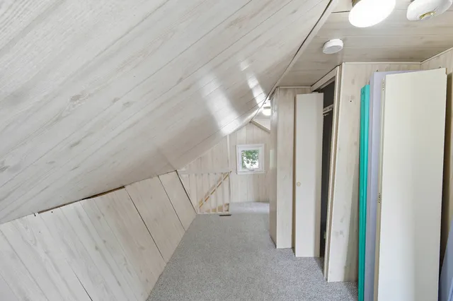 a bathroom with a toilet a sink and a shower