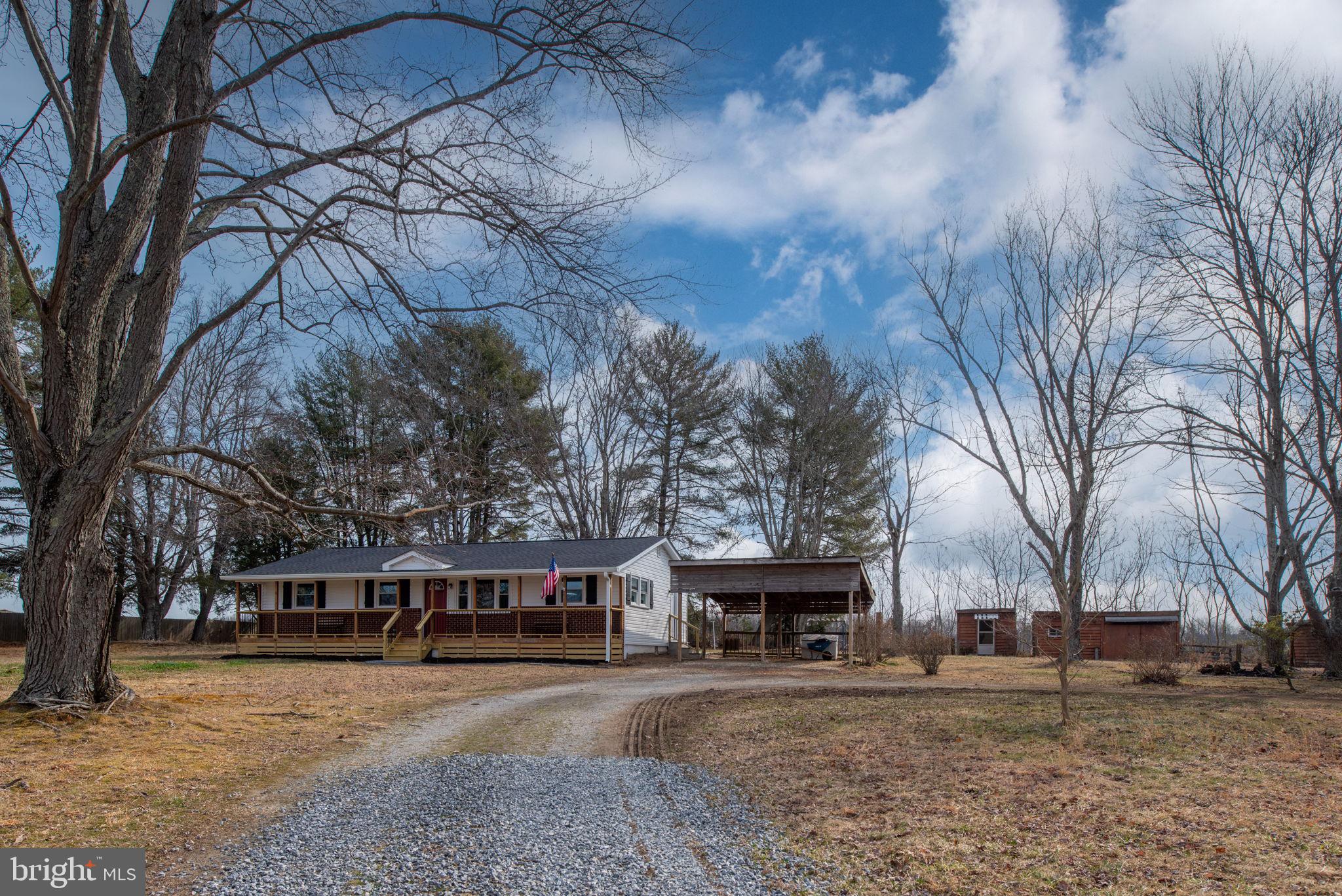8220 Marye Road Partlow, VA 22534 - Photo 44 of 67 a front view of a house with a yard and trees
