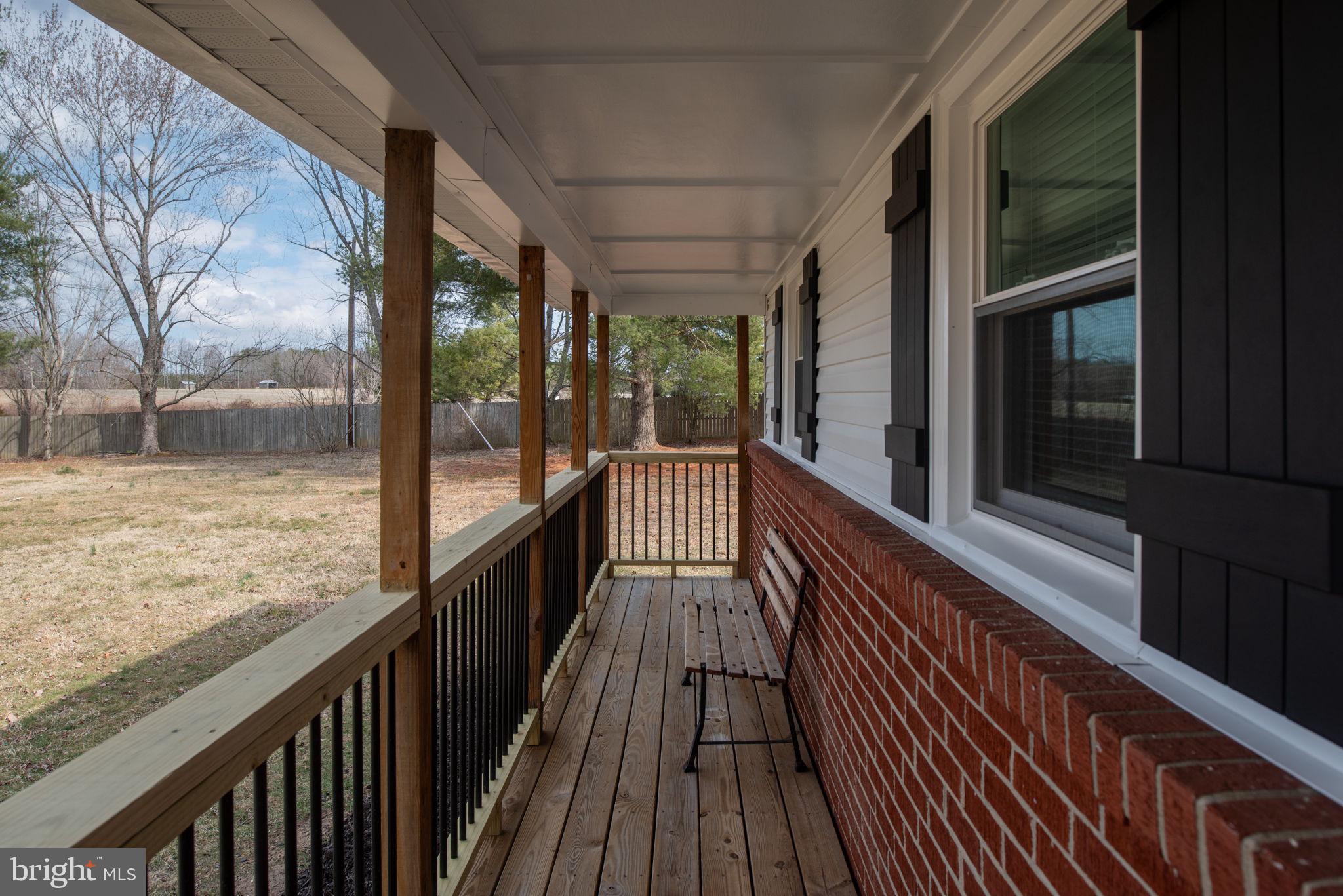 8220 Marye Road Partlow, VA 22534 - Photo 47 of 67 a view of balcony with wooden floor