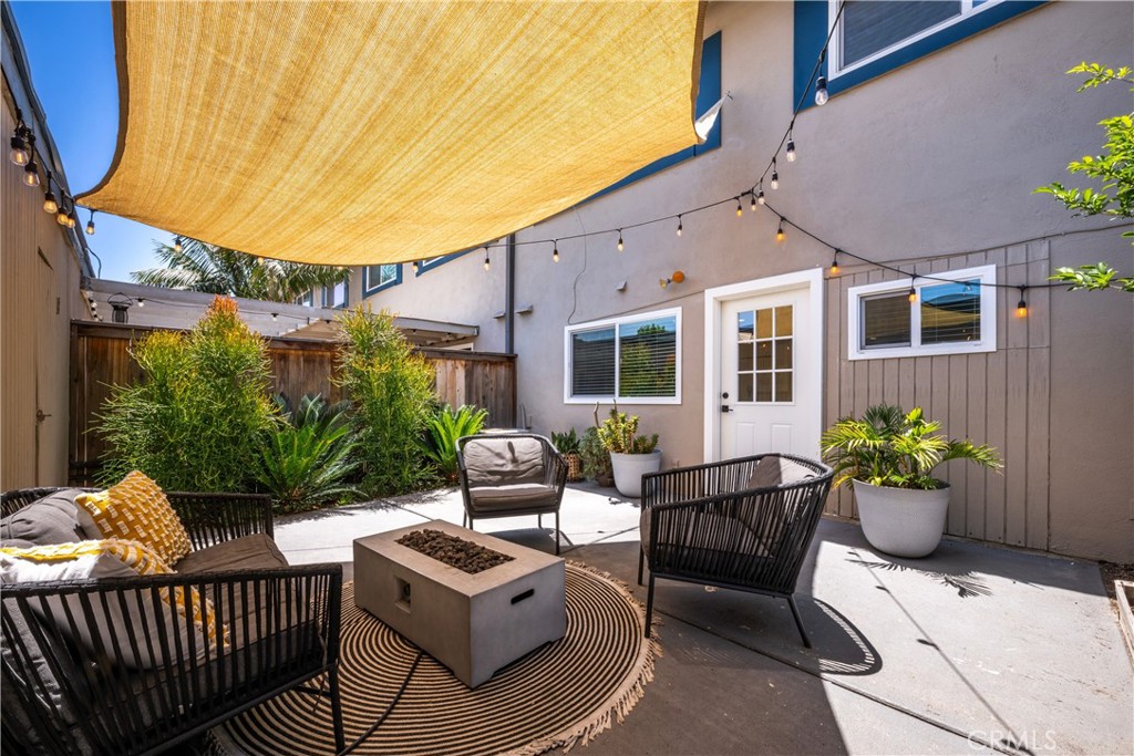 4237 Larwin Avenue Cypress, CA 90630 - Photo 34 of 48 a view of a patio with couches table and chairs and potted plants