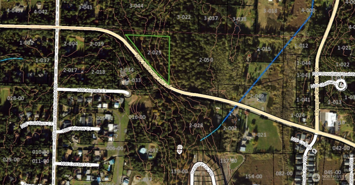 63-xx Northwest Anderson Hill Road Silverdale, WA 98383 - Photo 24 of 25 a view of staircase with railing and white walls