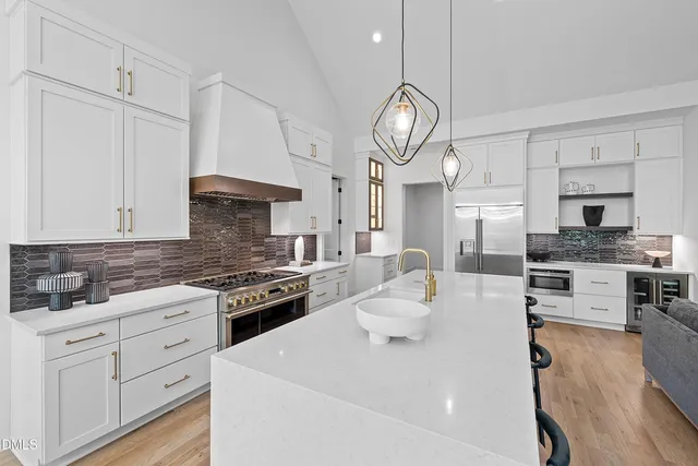 a bedroom with a bed flat screen tv and a large window