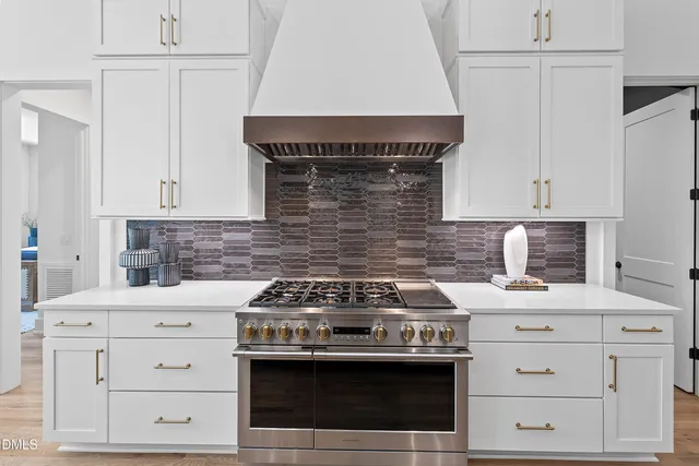 a spacious bedroom with a bed and a flat screen tv