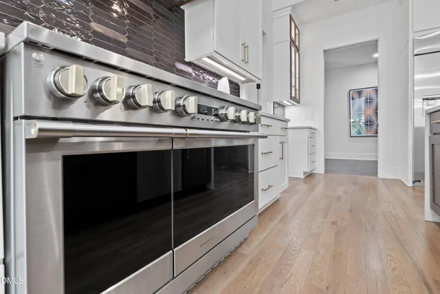 a white bath tub sitting next to a white sink