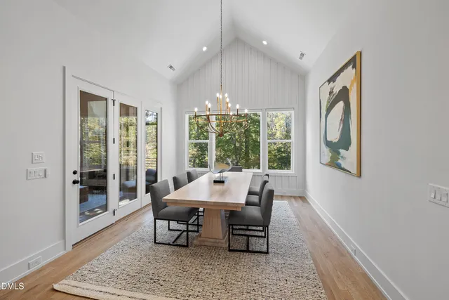 a view of a wooden deck with a yard