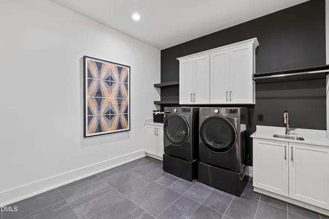 a bedroom with a bed and a flat tv screen on wall